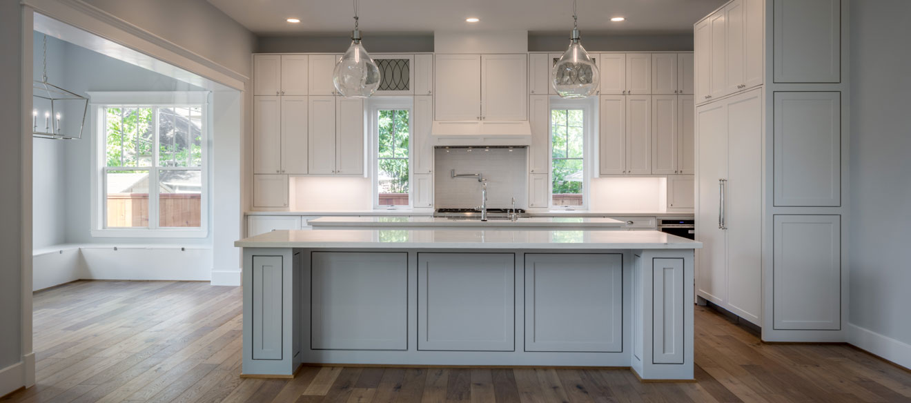 Custom design kitchen layout with a double island.