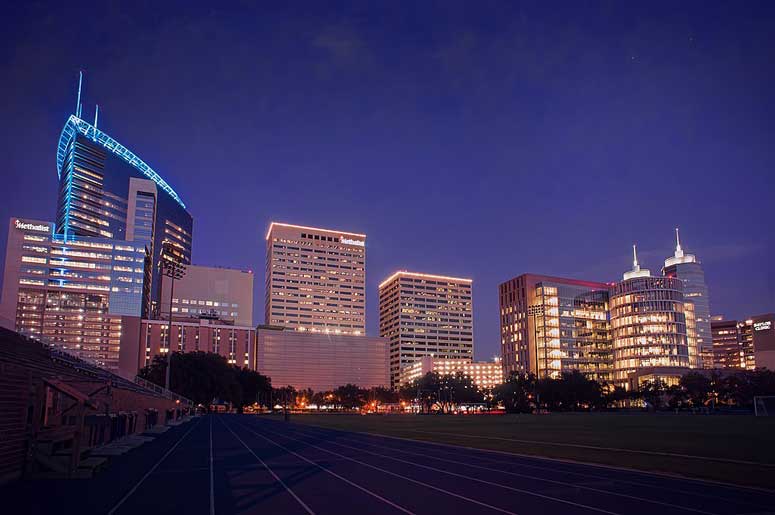 Exterior image at night with building lights showing the Texas Medical Center in Houston 